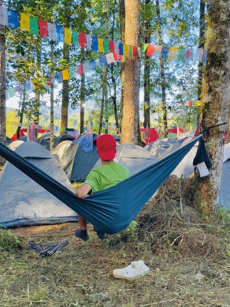 Camper enjoying a hammock view across the tent camp
