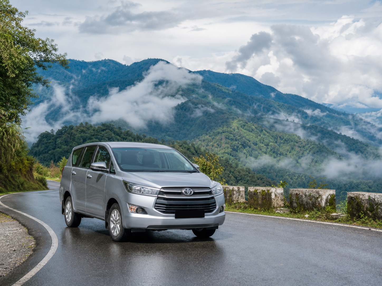 Innova on a rain-washed mountain road near Ziro